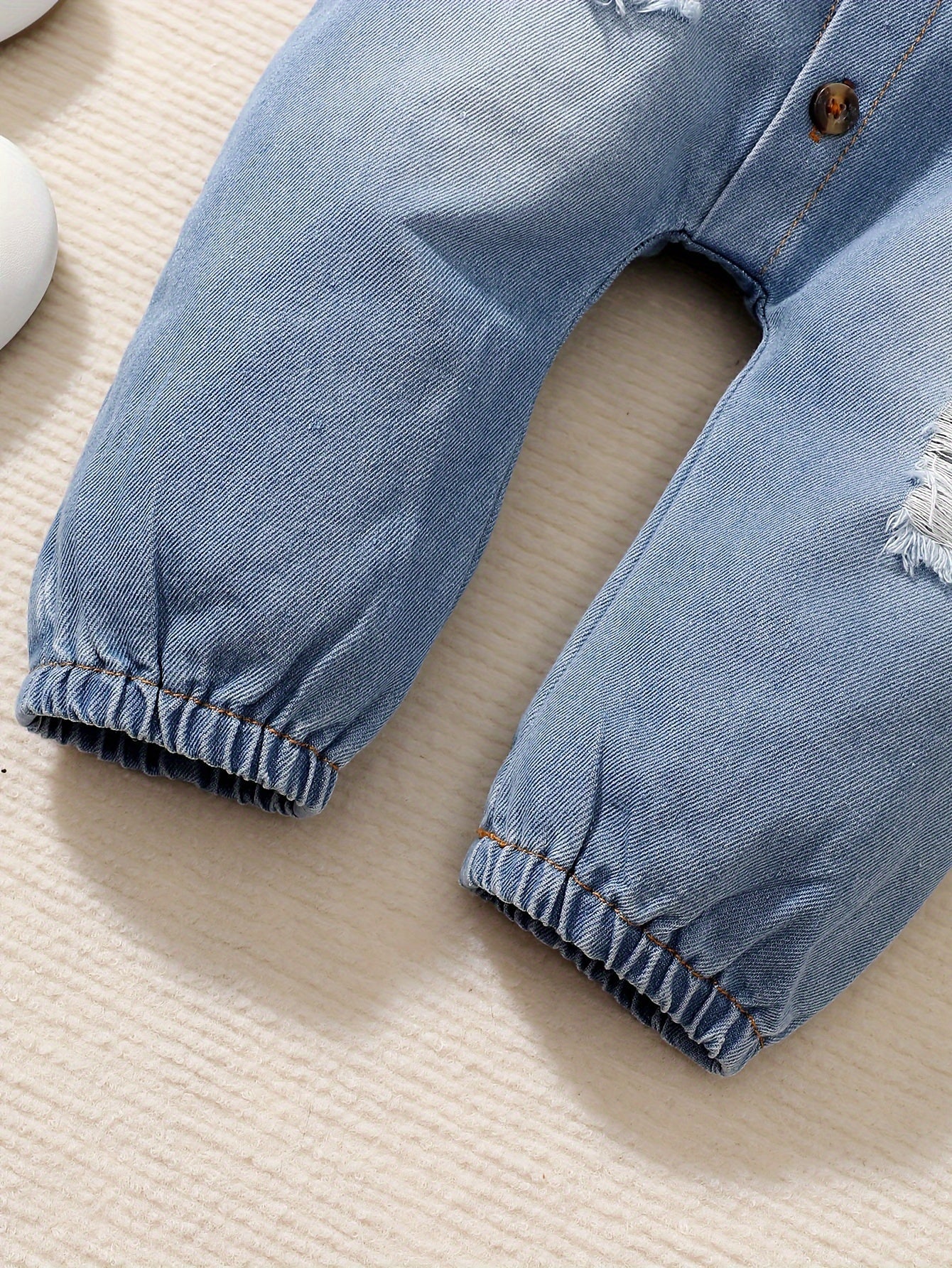 Denim Dreamcatcher Romper for Children – Playful Ruffles and Edgy Details